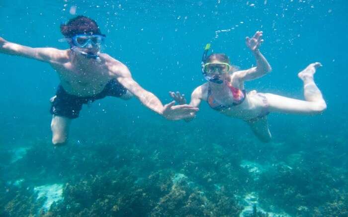 couple snorkelling at Mnemba Atoll