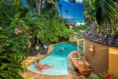 A couple relaxing in a private pool at Sandals Resort in the popular Caribbean honeymoon destination of Antigua