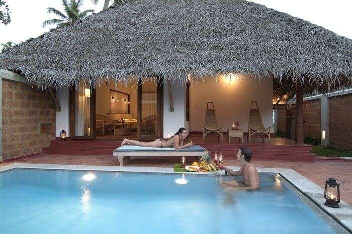 a couple swimming in a private pool of Marari Villa