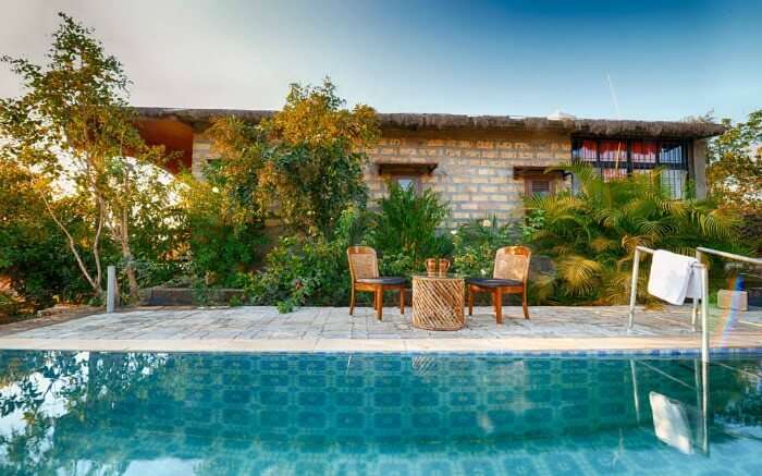 A pool by one of the cottages at Aryan Eco Homestay in Gujarat