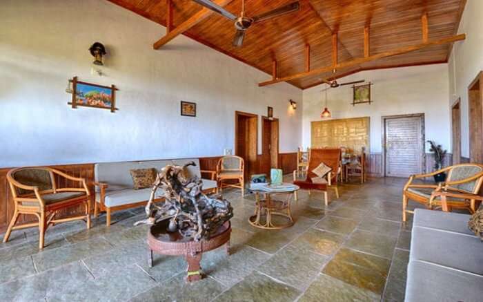 An interior view of the living area of Aranya Eco Farm Homestay in Gir