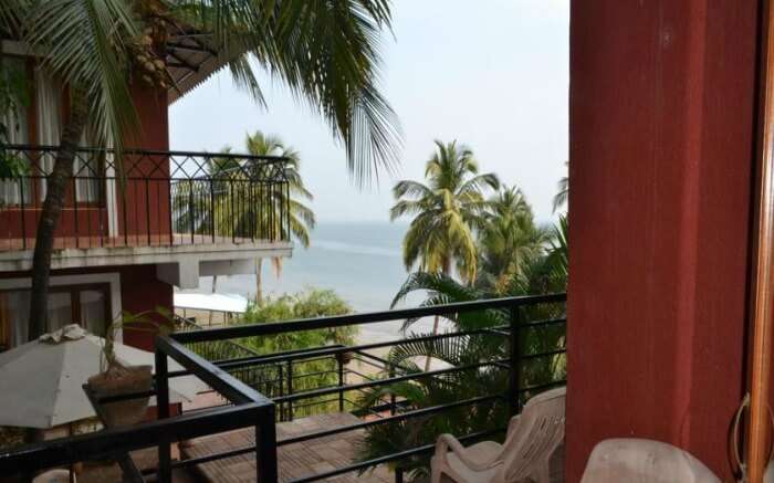 Balcony of Casa Tropicana Villa Caroline overlooking sea in Goa