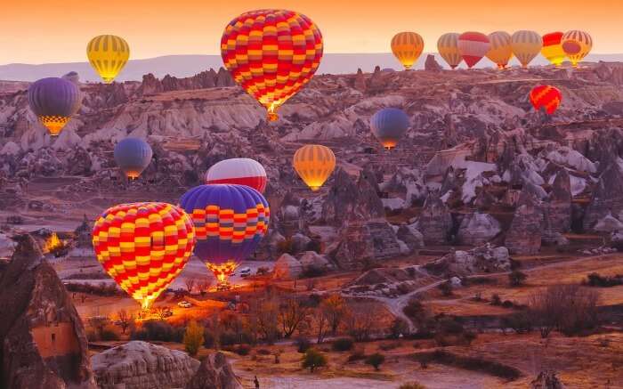 Hot air balloons flying over Cappadocia in Turkey in autumn
