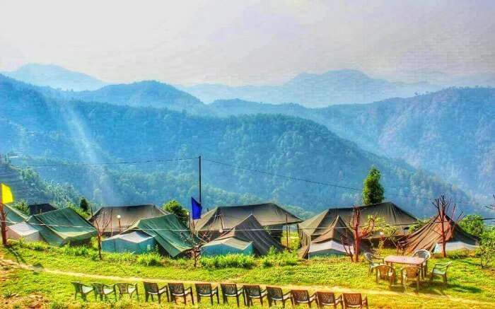 A glorious view of Kanatal Orchid Camps overlooking the vast mountains in Kanatal