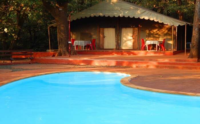 A tented accommodation of Westend Hotel by the swimming pool in Matheran