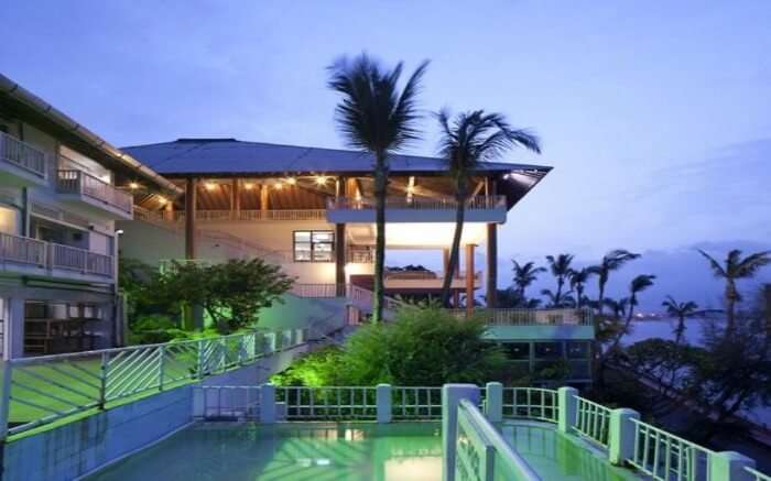 Side view of open seating area of Fortune Bay Resort Island overlooking sea in Port Blair