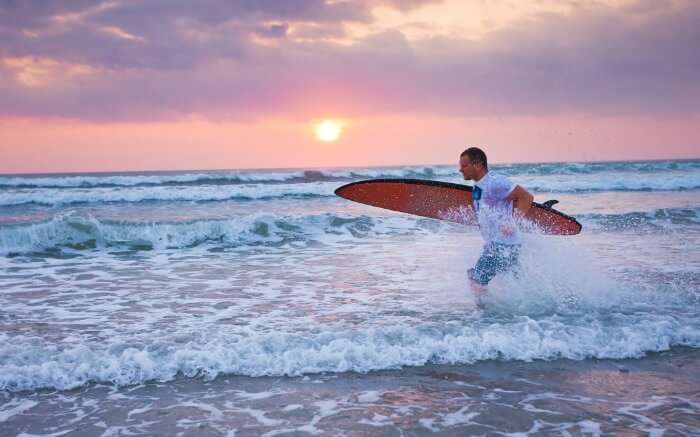 Surfer in a beach in Bali