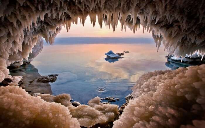 Cave on the Jordanian shore of the Dead Sea near Zara Spring, one of the best destinations to plan low-budget international trips