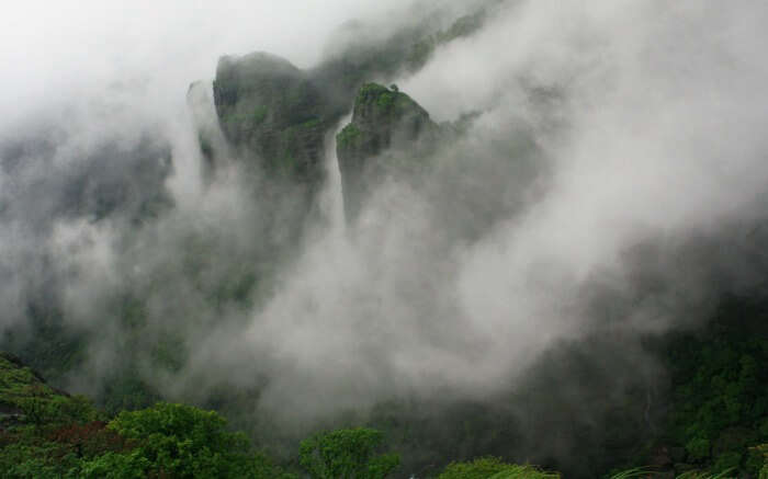 mountain peaks covered by mists