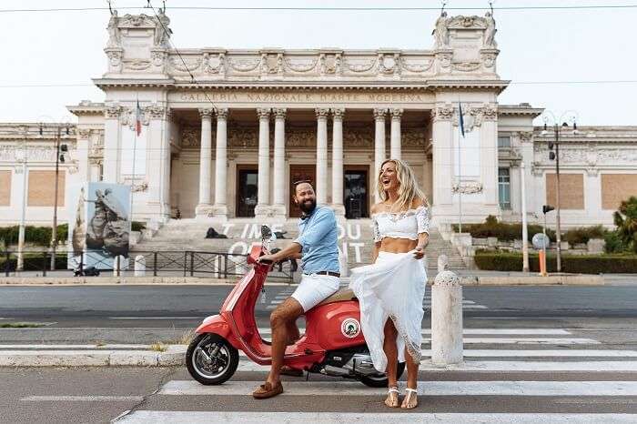 couple on vespa in rome