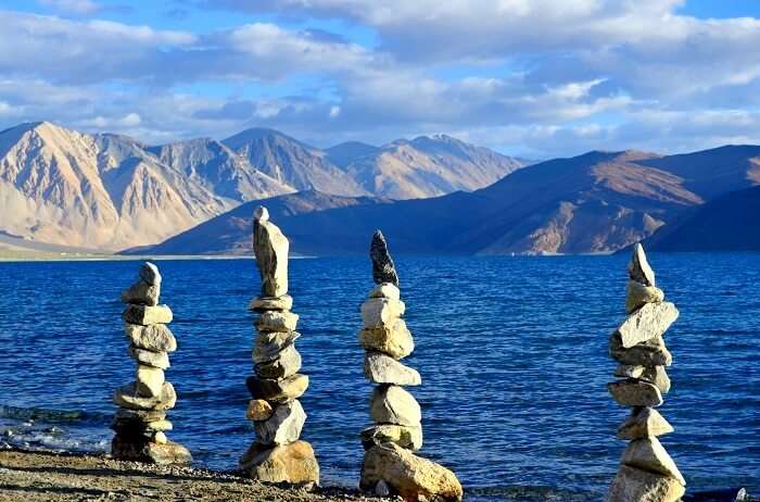 incredible cairns at pangong tso