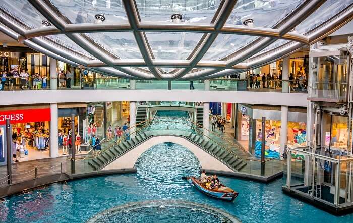 Luxury designer handbags on display in a Singapore shopping mall