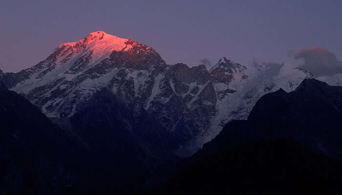 Light of sun on a snow clad peak 