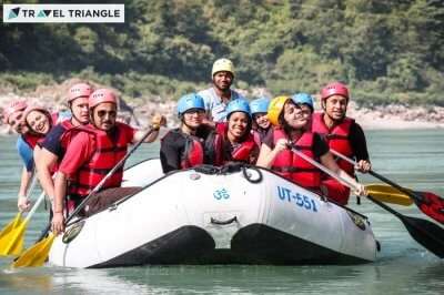 a group of people rafting in Rishikesh