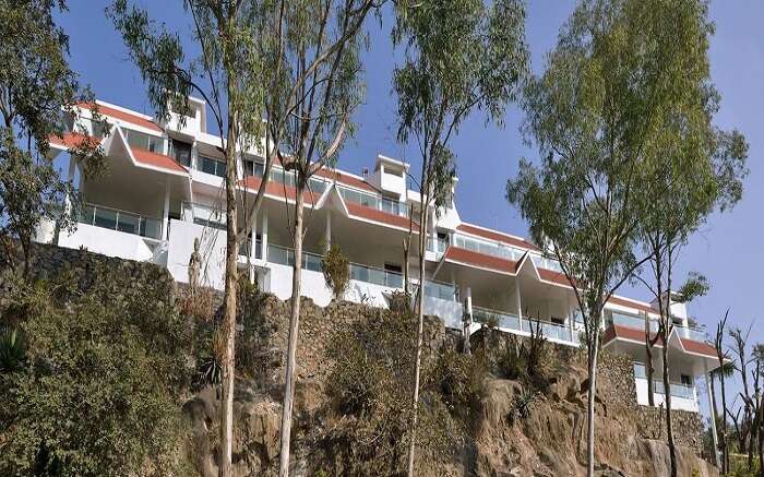 A view of Aranya Resorts perched atop a lofted platform in Mount Abu