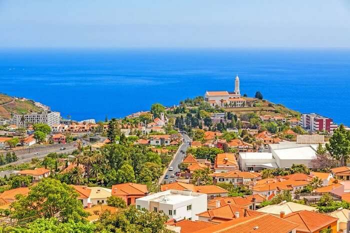 Church of Sao Martinho - a civil parish in the municipality of Funchal. View from Pico dos Barcelo - south coast of Madeira - Atlantic Ocean in the background.