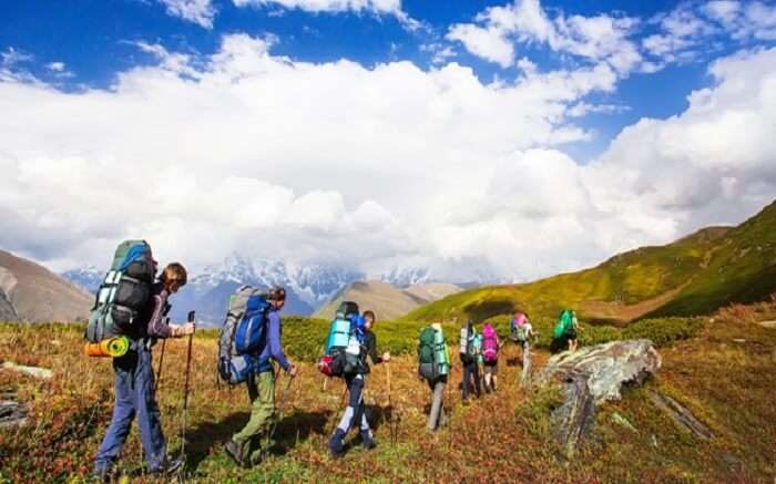 Travelers walking through the mountains in Uttarakhand 