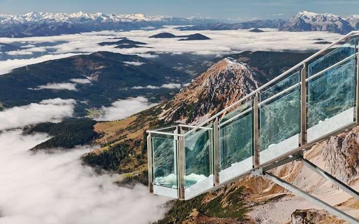 glass platform overlooking beautiful mountains 