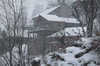 snow covered house in mountains