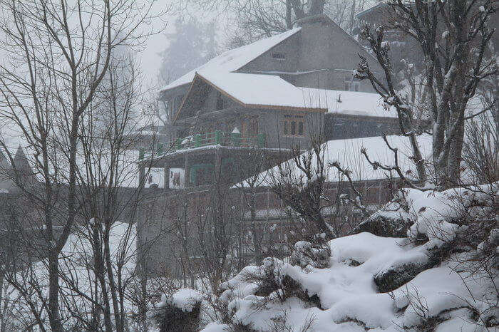 snow covered house in mountains