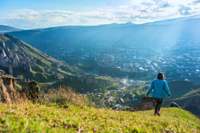 a girl running down the mountains