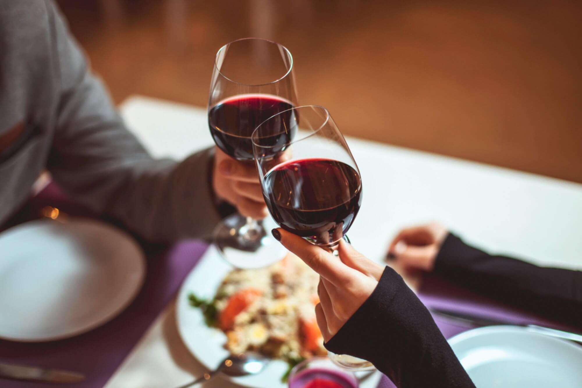 couple holding wine glass in their hands in Bulgaria