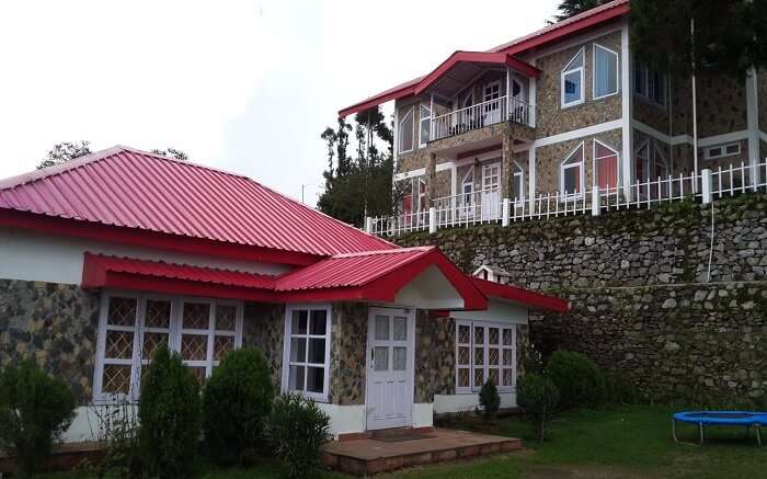 a beautiful resort with red roof