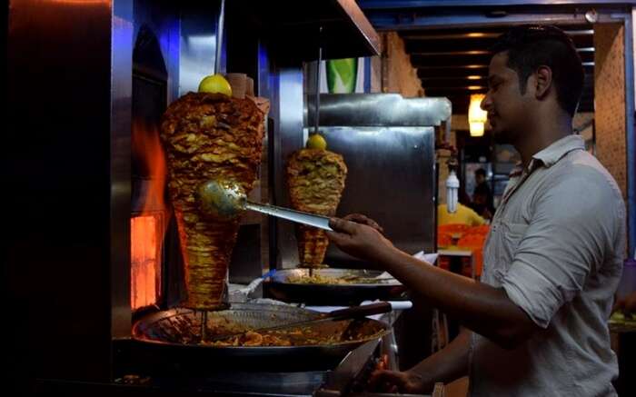 A man preparing Shawrma in Panji in Goa