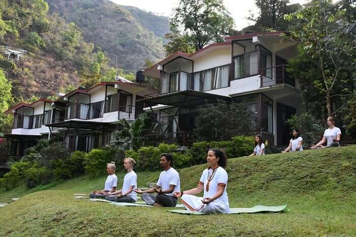 people doing yoga in dhanaulti resort
