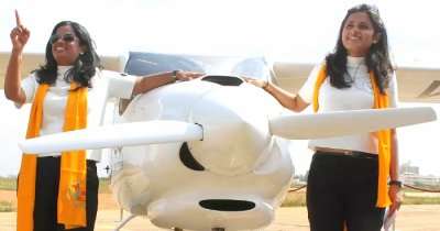 mother daughter with a light aircraft