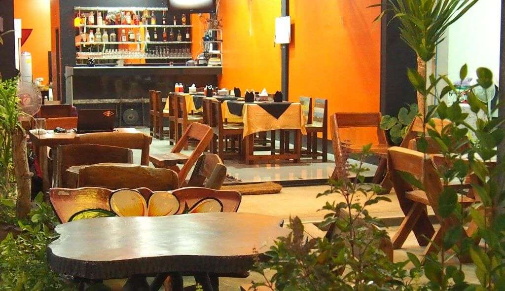 wooden furniture and beautiful decor of an Indian restaurant