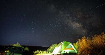 camping under dark sky