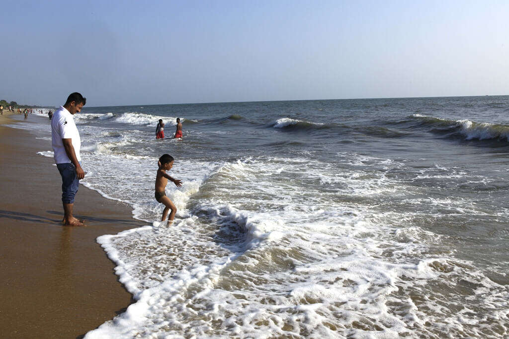 people playing in sea waves