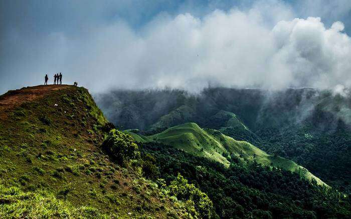 Trekkers after reaching summit on a trek in Coorg