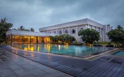 a luxurious hotel with a huge outdoor pool ss01052018