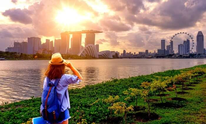 woman looking at singapore skyline in june