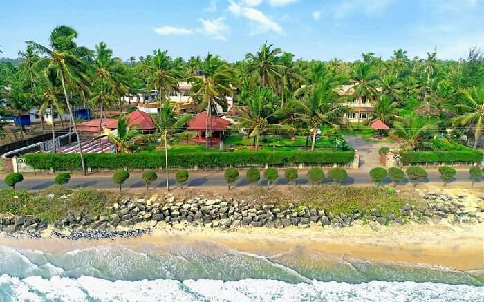 Ashokam Beach Resort with a grand lawn and beach views ss