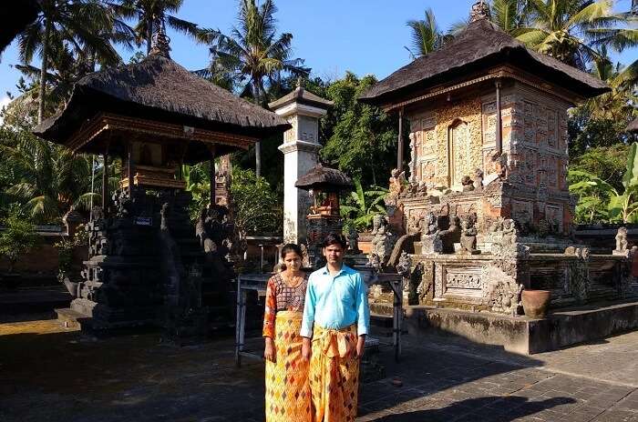 couple outside temple in bali