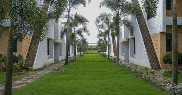 a lush lawn of a Belgaum resort