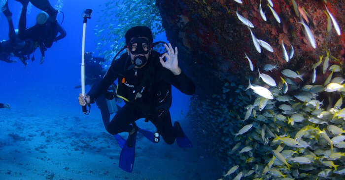 A diver showing OK sign under water