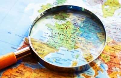 Magnifying glass on a map of France