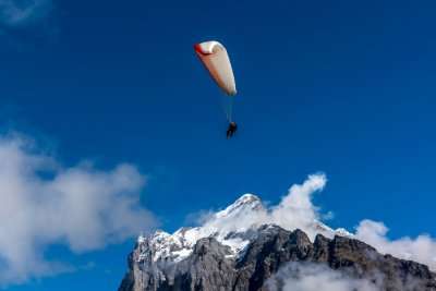 paragliding on snow m,ountains