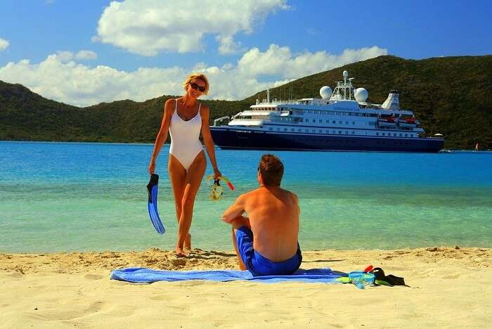 Man and women on beach enjoying