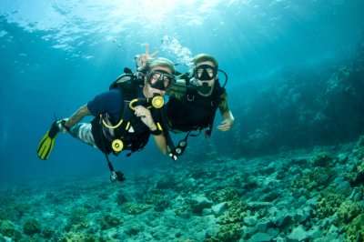 Two scuba divers under the ocean