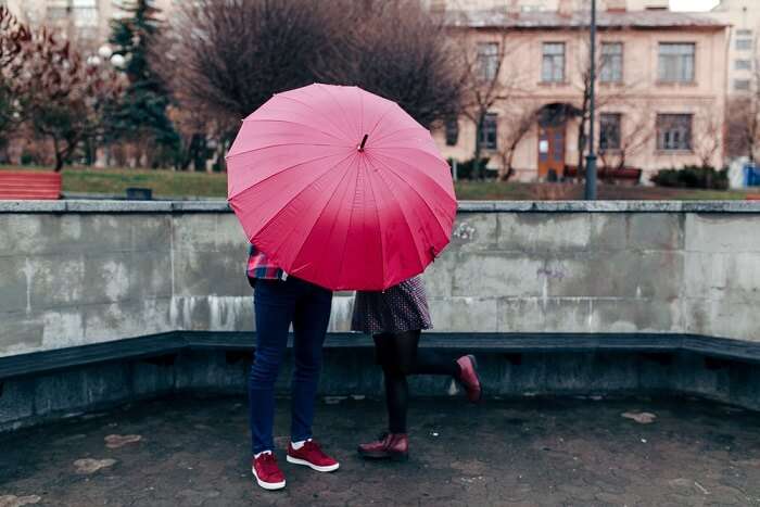 Kiss under umbrella
