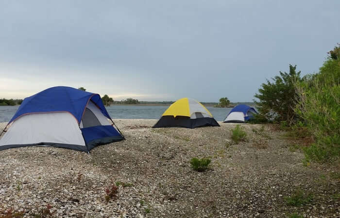 Camp on the beach to save accommodation fees
