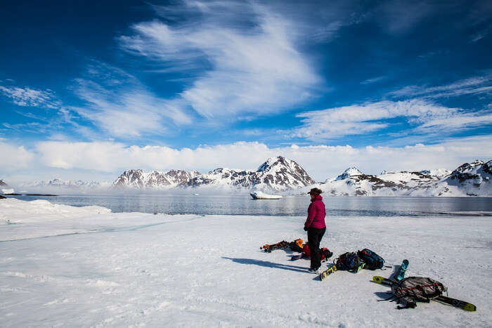 person stepping on the ice in greenland