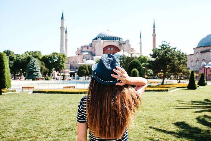 woman looking at the famous mosque in Istanbul