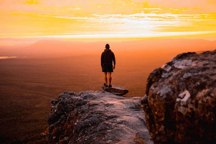 man standing on a famous cliff in Melbourne