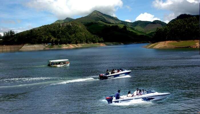 people enjoying motorboat ride on a lake
